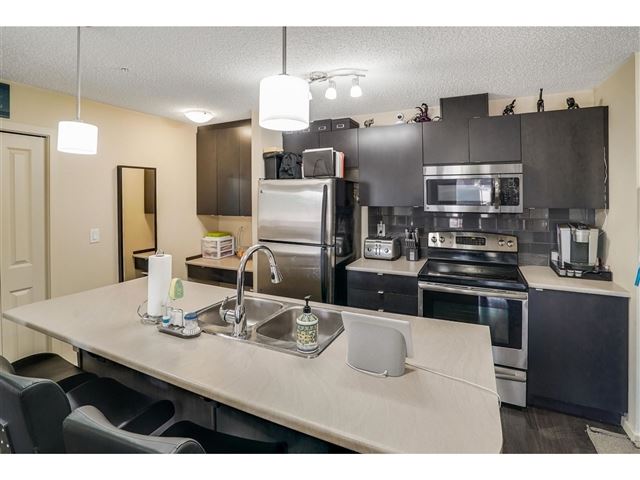 3357 16a AVE NW - 114 3357 16a Avenue Northwest - photo 1